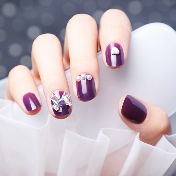 Wearing Nails With Diamonds And Purple Nails